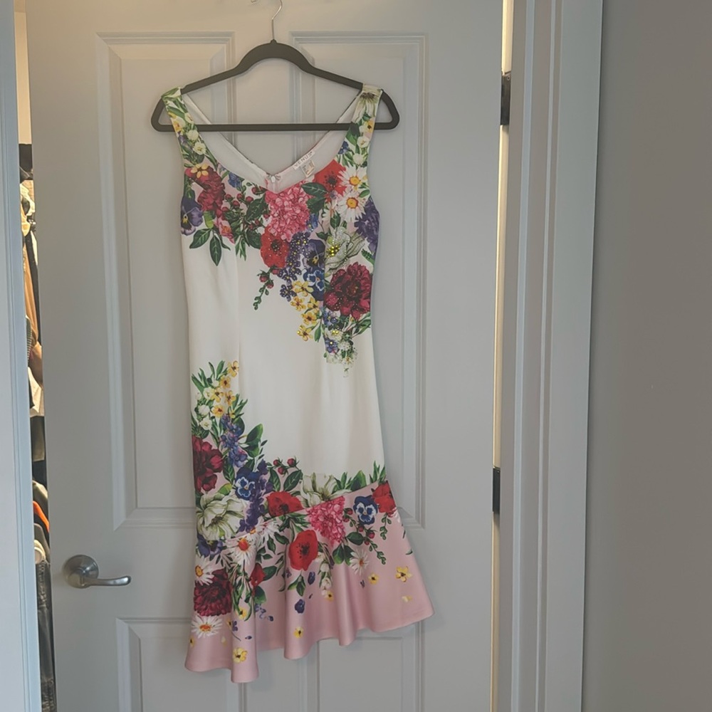 Flower, gemmed dress.